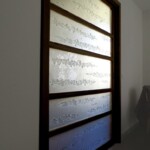 porte coulissante
en verre et bois